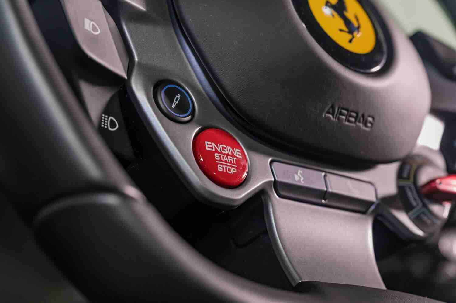 Ferrari steering wheel with red start/stop button